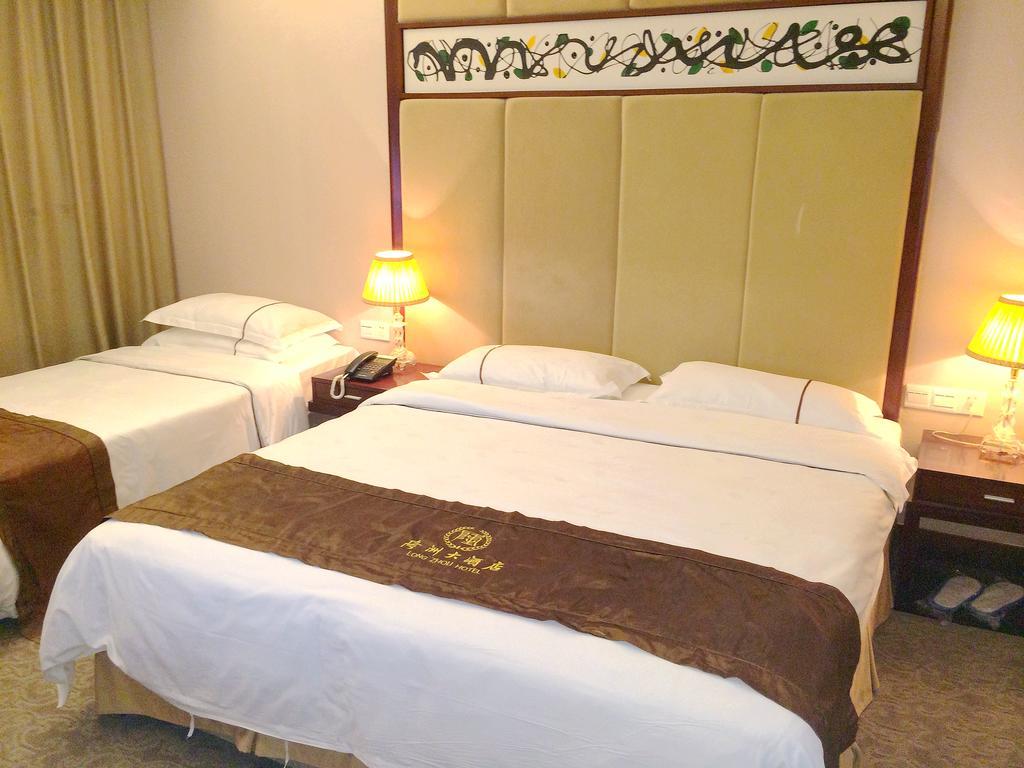 Long Zhou Grand Hotel Γκουανγκζού Δωμάτιο φωτογραφία